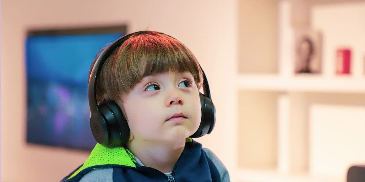 little boy wearing headphones