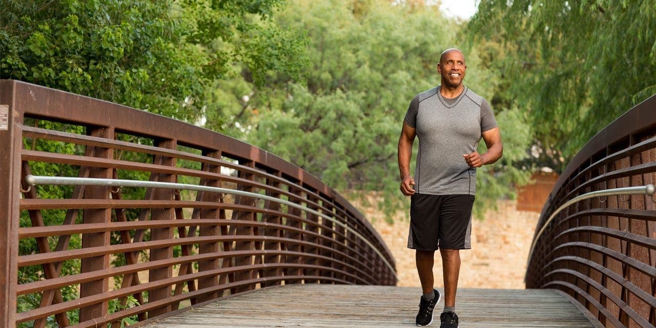 a man walking across the bridge