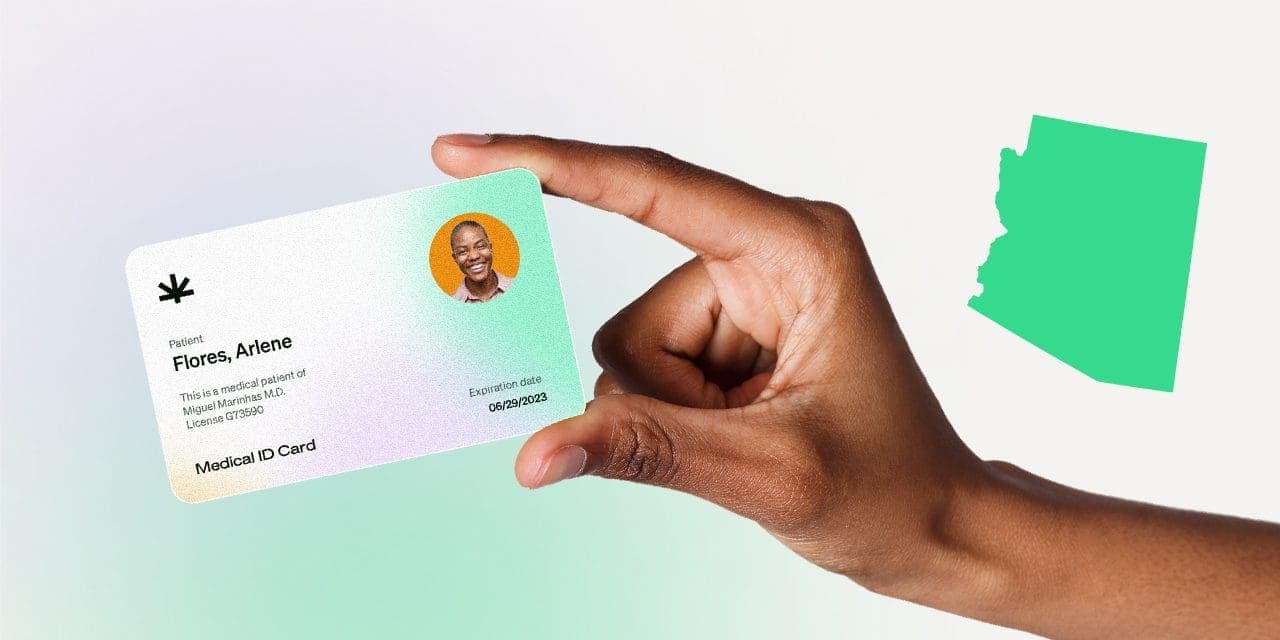 closeup hand holding MMJ card