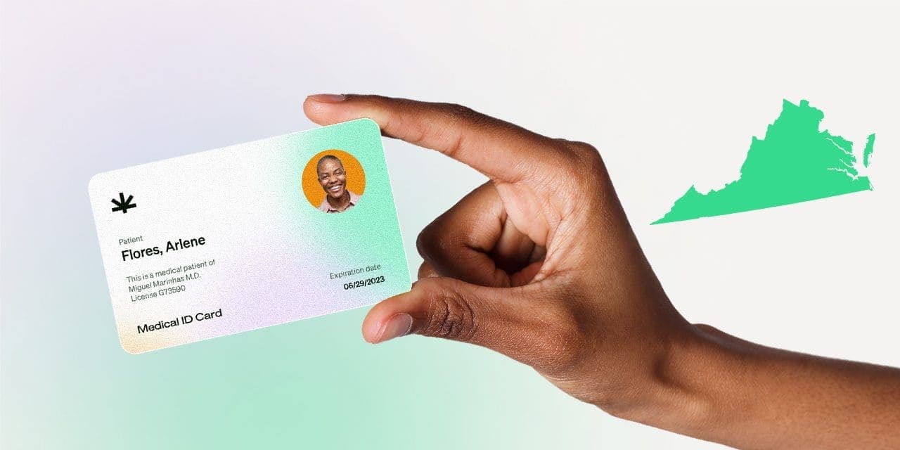 closeup hand holding MMJ card